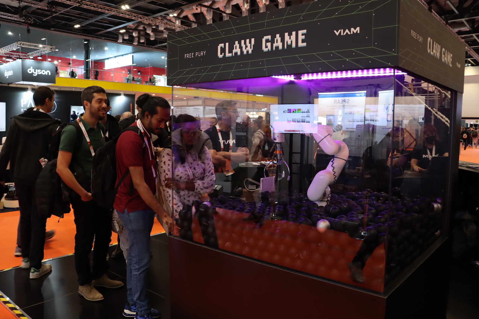 Viam enclosed robotic arm as a claw game at a conference